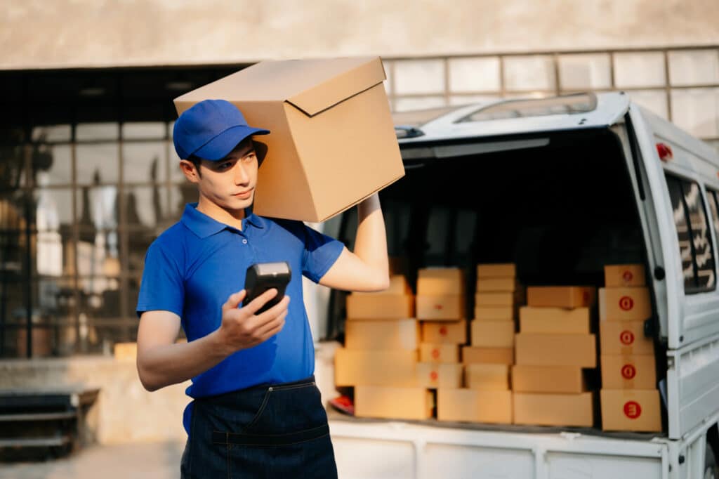 express delivery service. courier delivering package to man deli